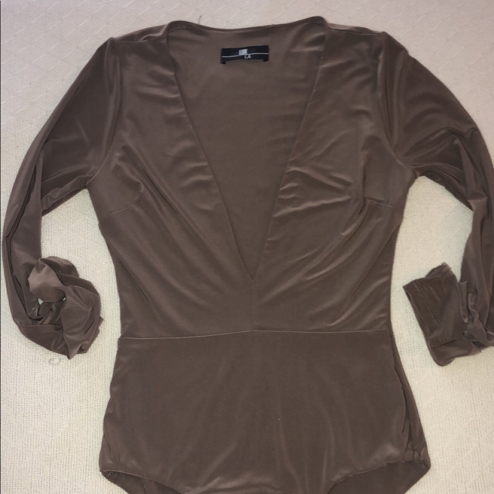 Long sleeve bodysuit. Low cut.